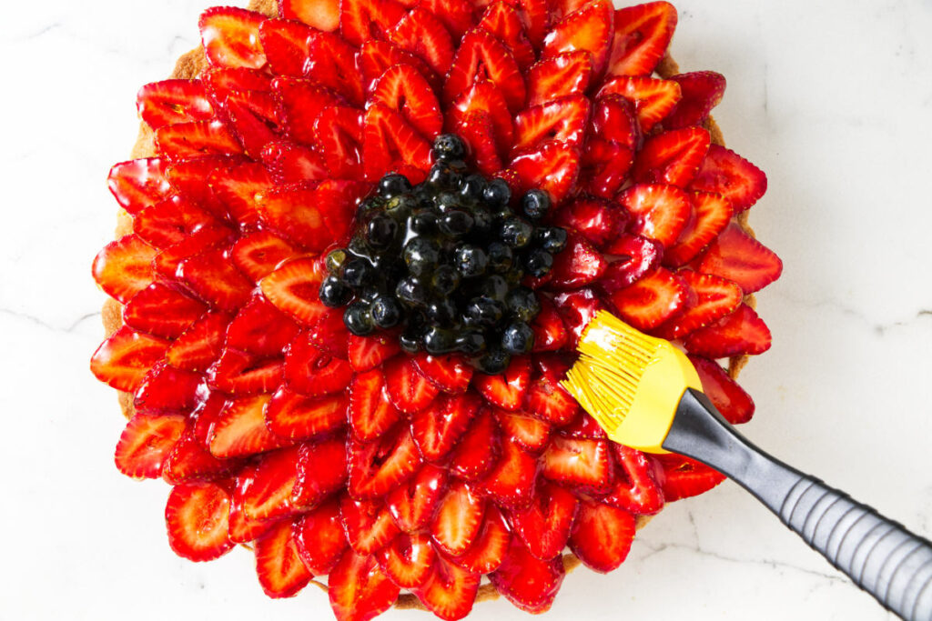 Brushing glaze on fruit.