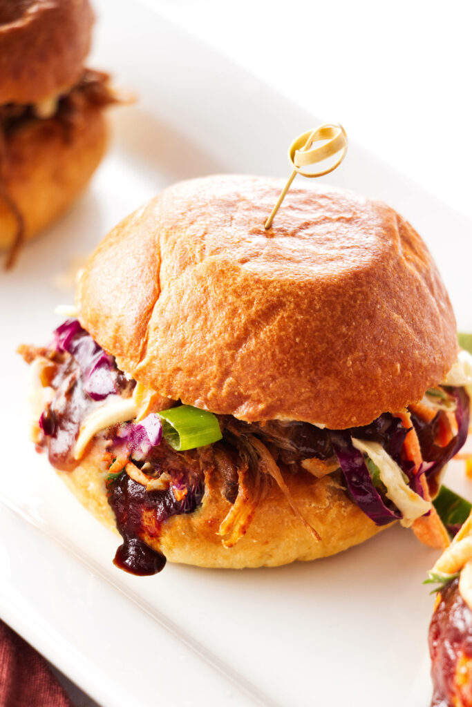 Close up of a ready-to-eat pulled pork slider.