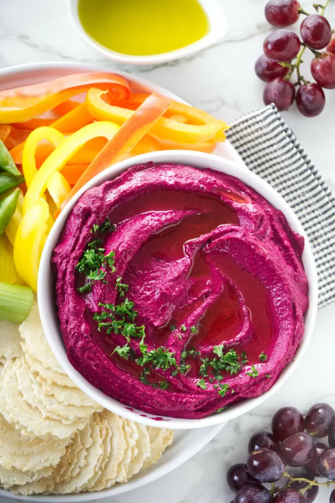 Red beet hummus with veggies for dipping.