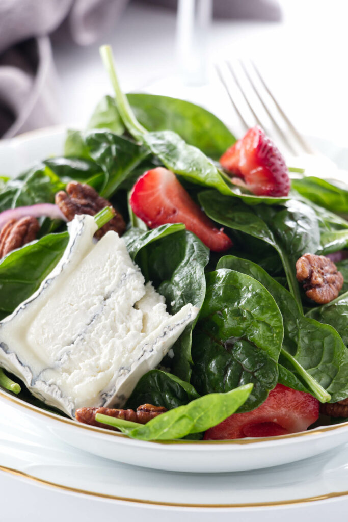 Close up view of a serving of Strawberry Spinach Salad
