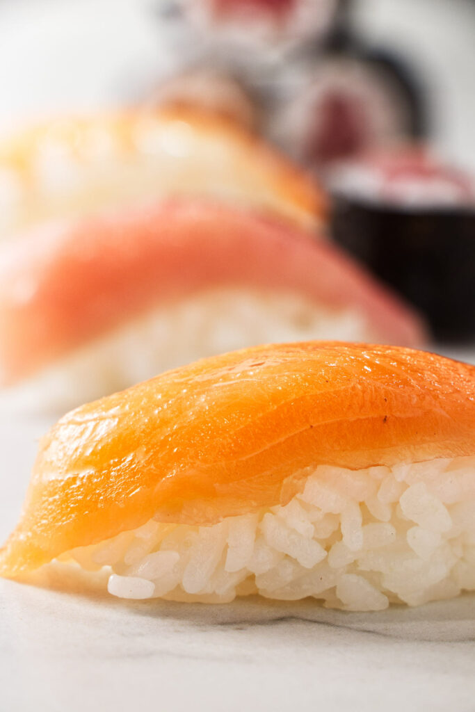 Sushi and nigori made with sushi rice.