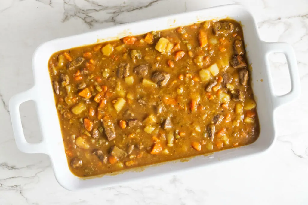 Thick lamb stew in a casserole dish.