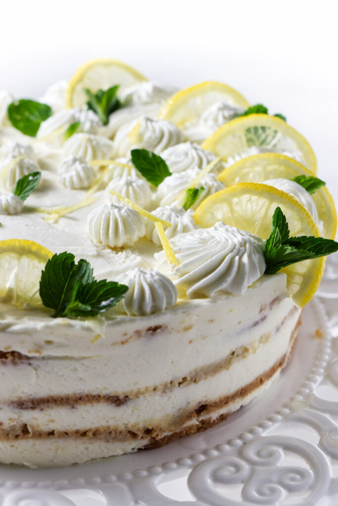 A creamy, no-bake cake with lemons on top.