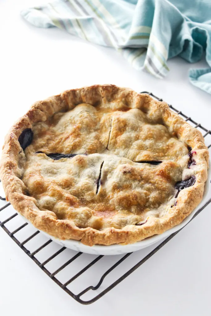 Baked berry pie on a cooling rack