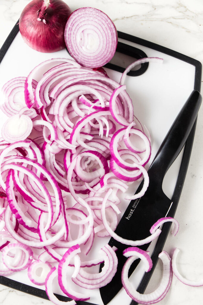Slicing red onions.