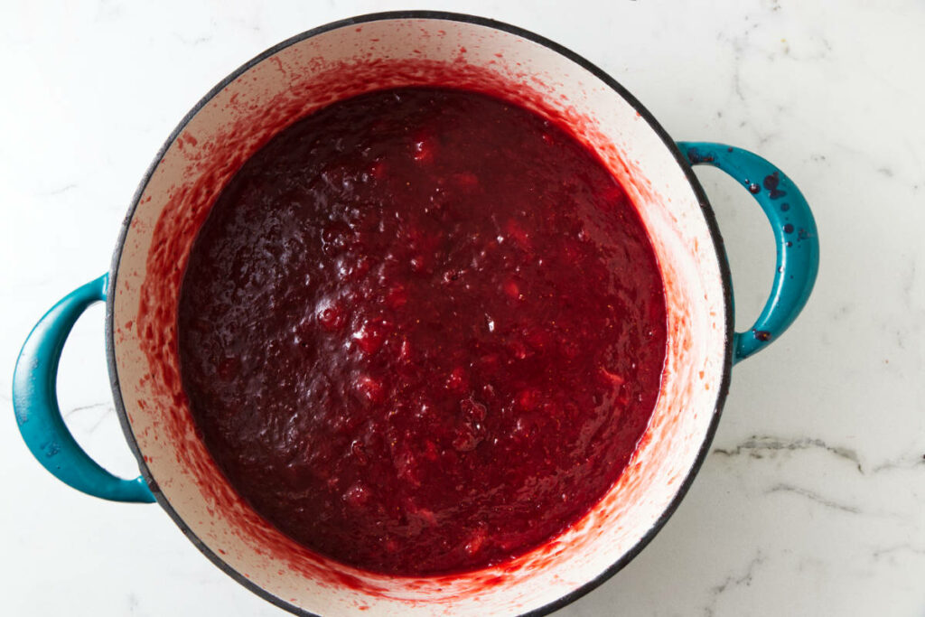 A pot of strawberry rhubarb jam after it boils and reduces.