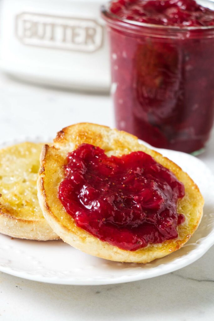 Strawberry rhubarb jam on an English muffin.