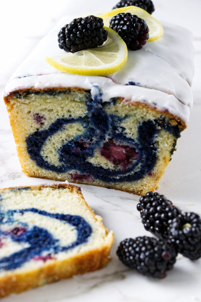 A loaf of blackberry bread with a swirl of jam in the center. 