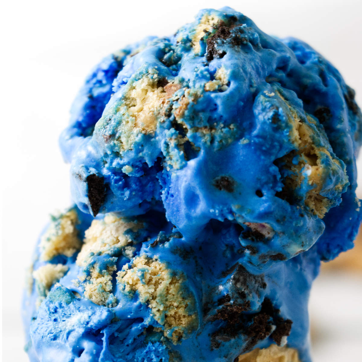 Chunks of cookies blended into blue ice cream.