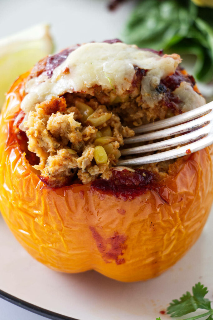 A fork in a stuffed bell pepper.