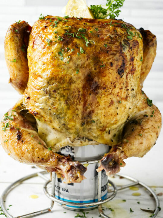 A smoked chicken on a beer can.