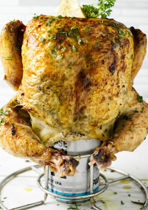 A smoked chicken on a beer can.