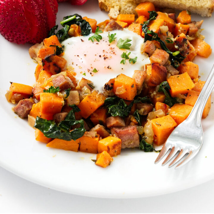 A serving of sweet potato breakfast hash with an egg.