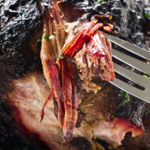 Showing the smoke ring on a smoked pork shoulder.