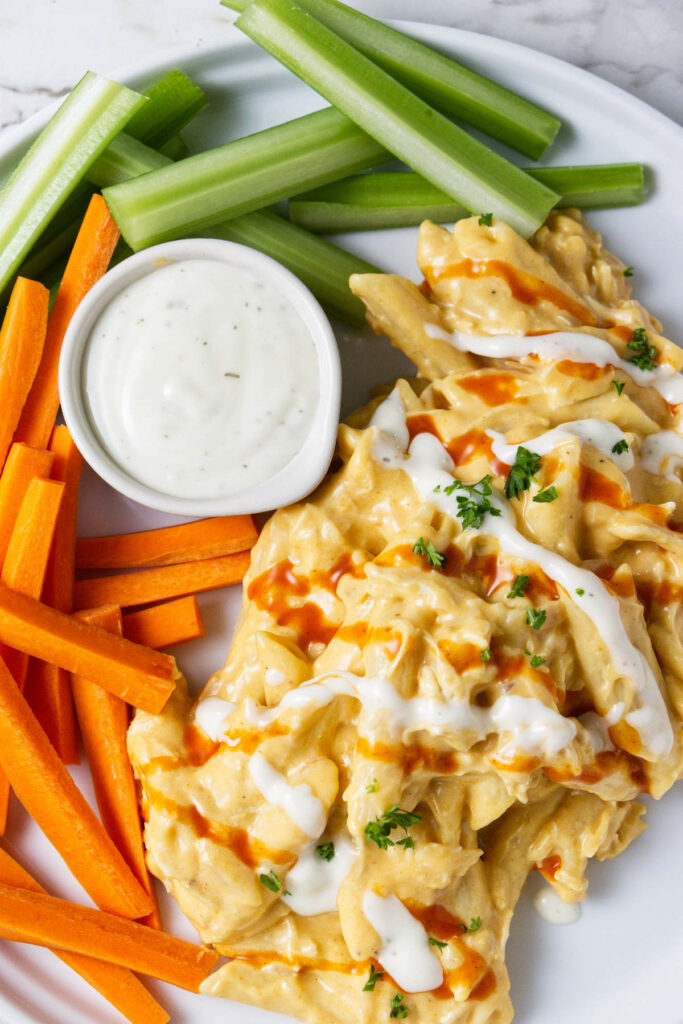 Pasta drizzled with Buffalo sauce and blue cheese dressing.