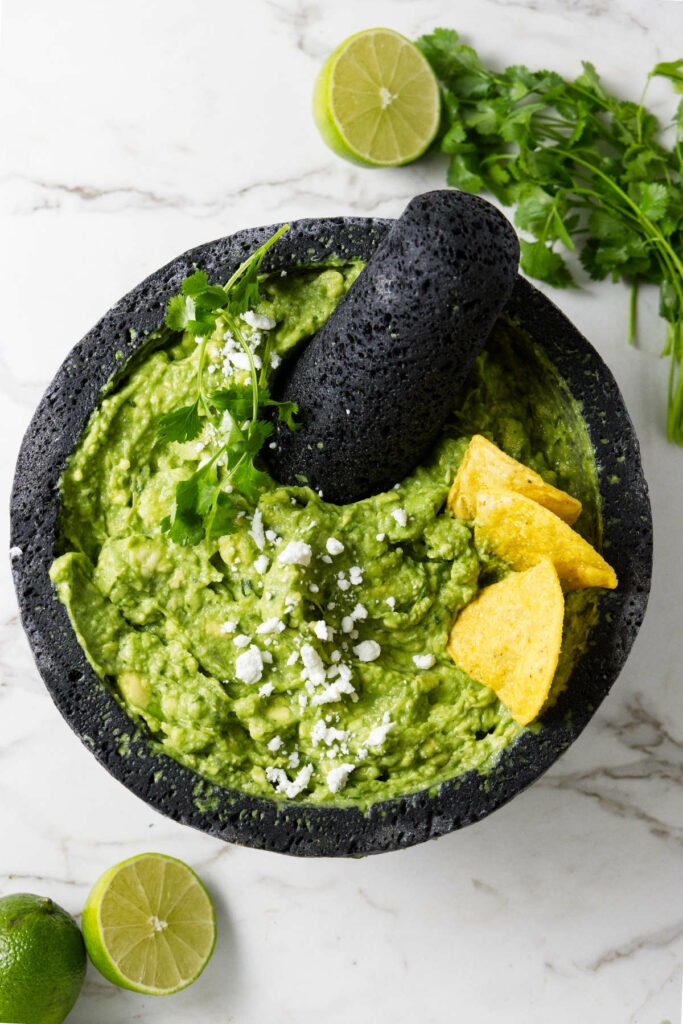 A molcajete filled with guacamole.
