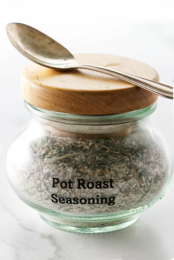 Glass container with pot roast seasoning