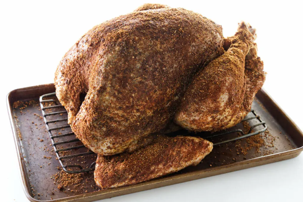 A turkey with Cajun dry brine on the skin.