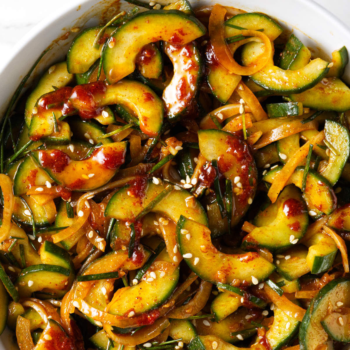 A serving bowl filled with Korean cucumber salad.