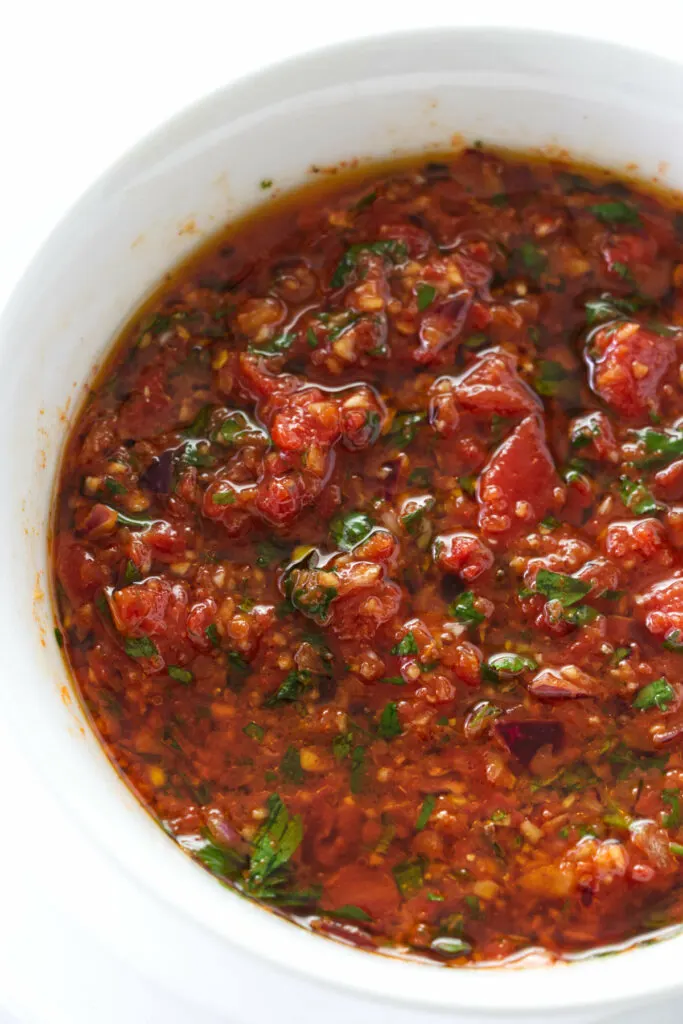 close up photo of a dish of red chimichurri