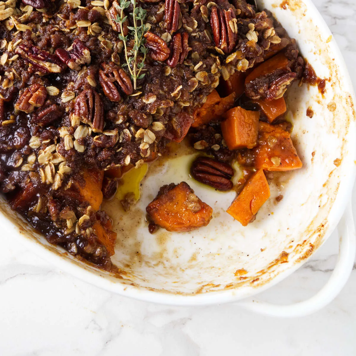 Sweet potato casserole with a crunchy pecan topping.