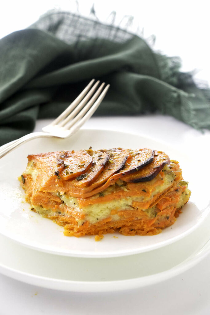 a serving of sweet potato casserole on a white plate.