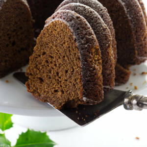 Serving a slice of bundt cake on a cake server.