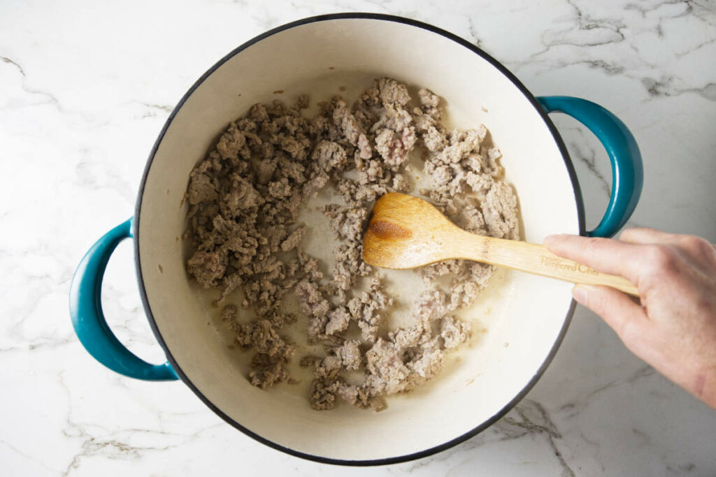 Browning turkey meat in a pot.