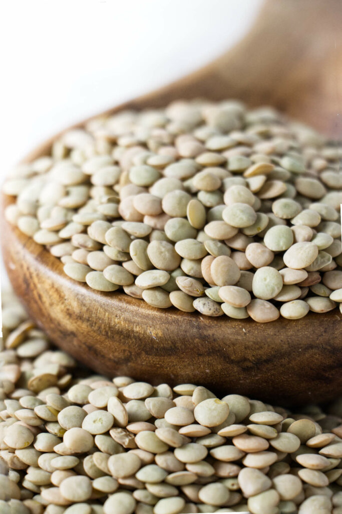 Lentils in a wooden dish.