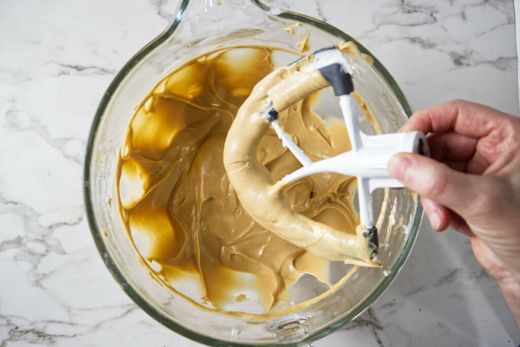 Beating the caramel filling until smooth.