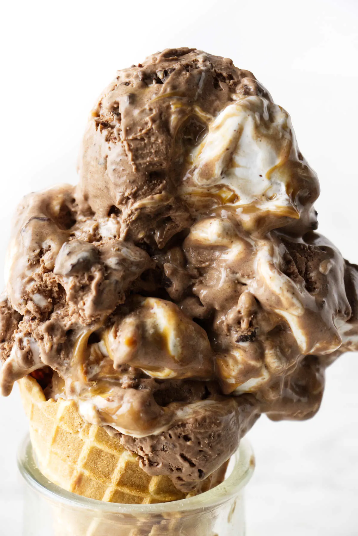 Chocolate marshmallow ice cream on a sugar cone.