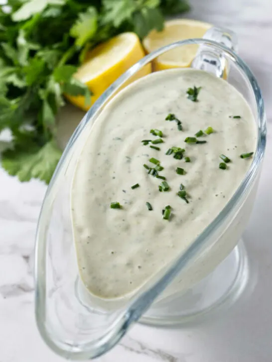 Tahini dressing in a glass container.