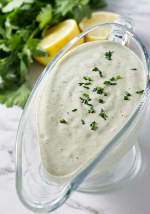 Tahini dressing in a glass container.