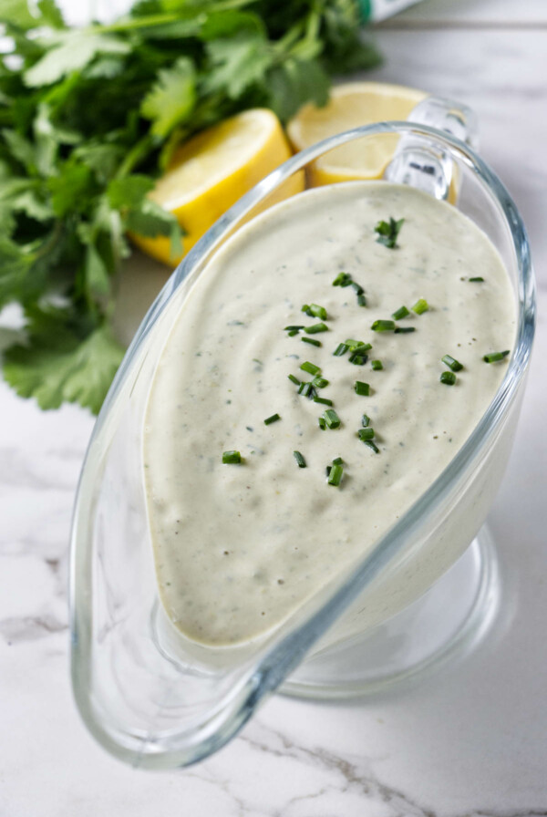 Tahini dressing in a glass container.