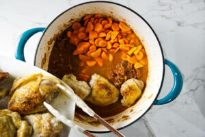 Adding carrots and chicken back to the pot.