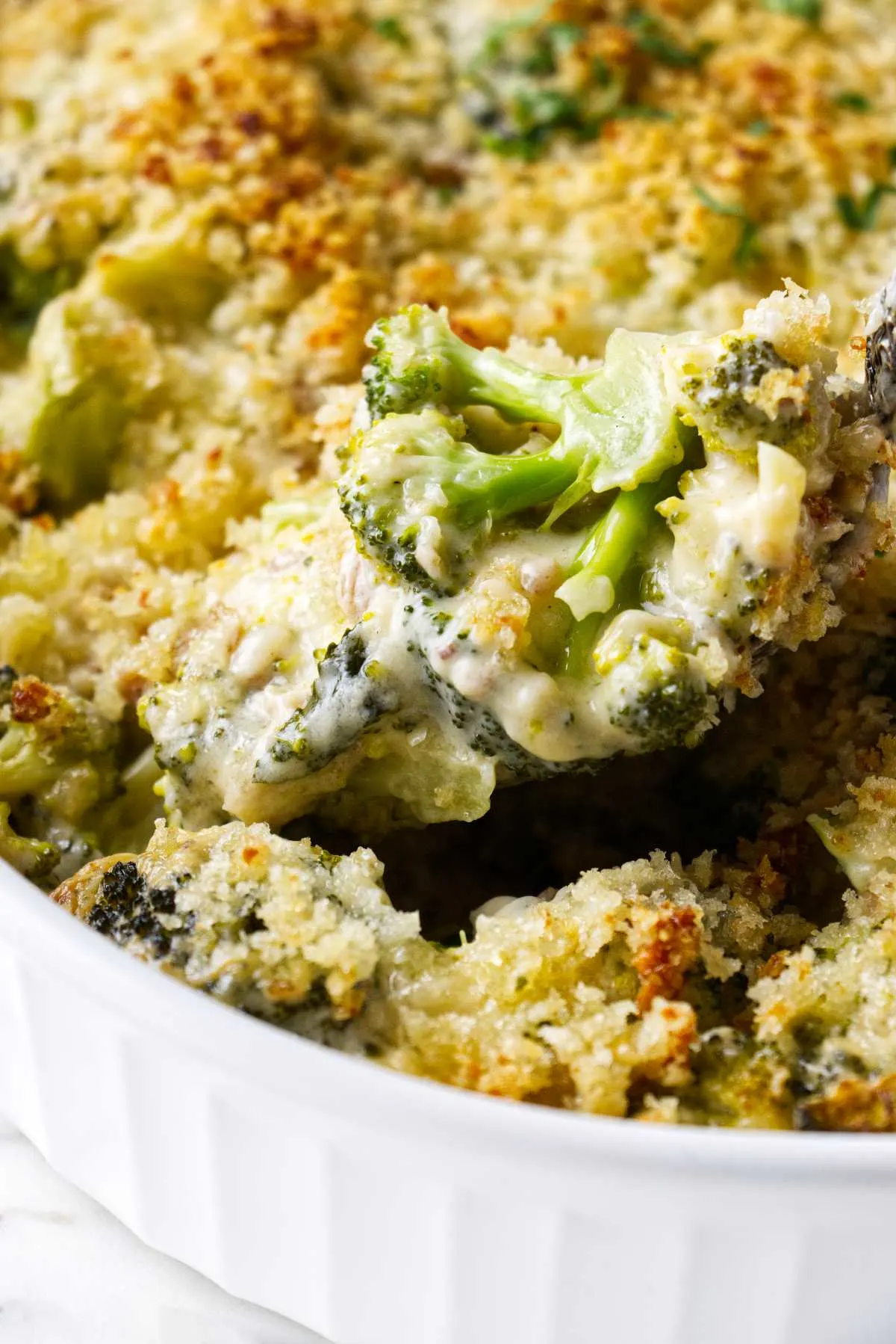 A casserole dish of creamy broccoli casserole.