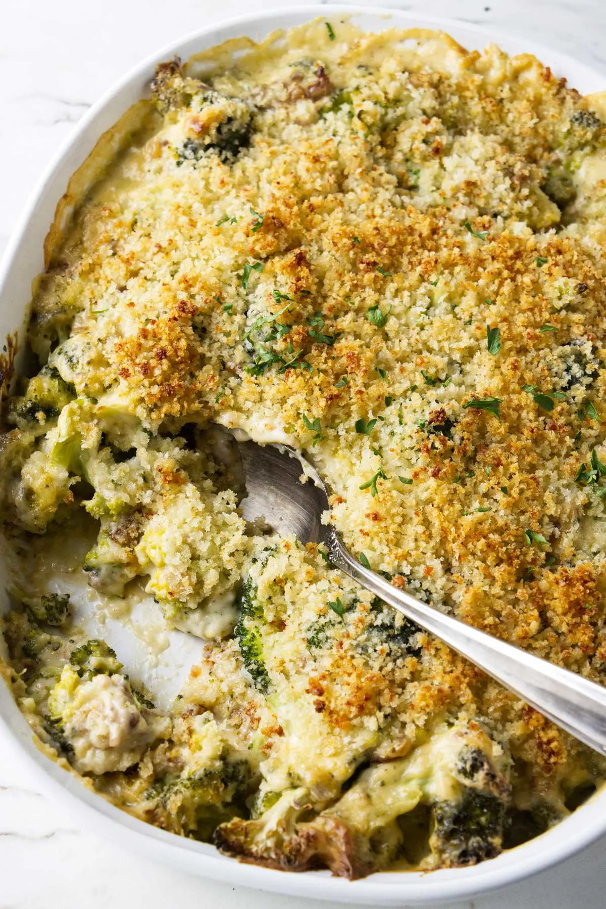 A casserole dish with creamy broccoli.