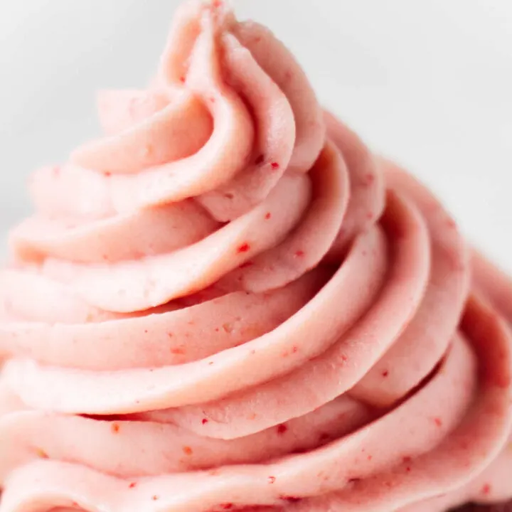 Strawberry cream cheese frosting piped in a mound.