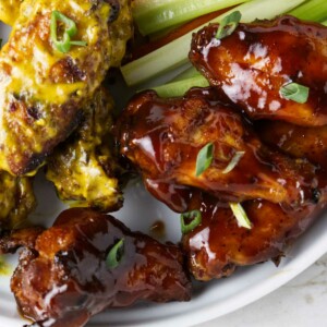 Traeger chicken wings smothered in bbq sauce.