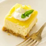 Lemon Cheesecake Bites on a plate with a fork.