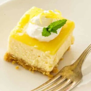 Lemon Cheesecake Bites on a plate with a fork.