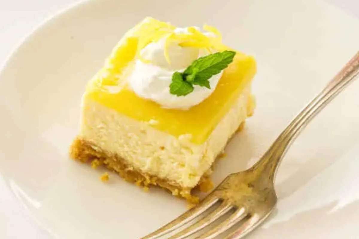 Lemon Cheesecake Bites on a plate with a fork.