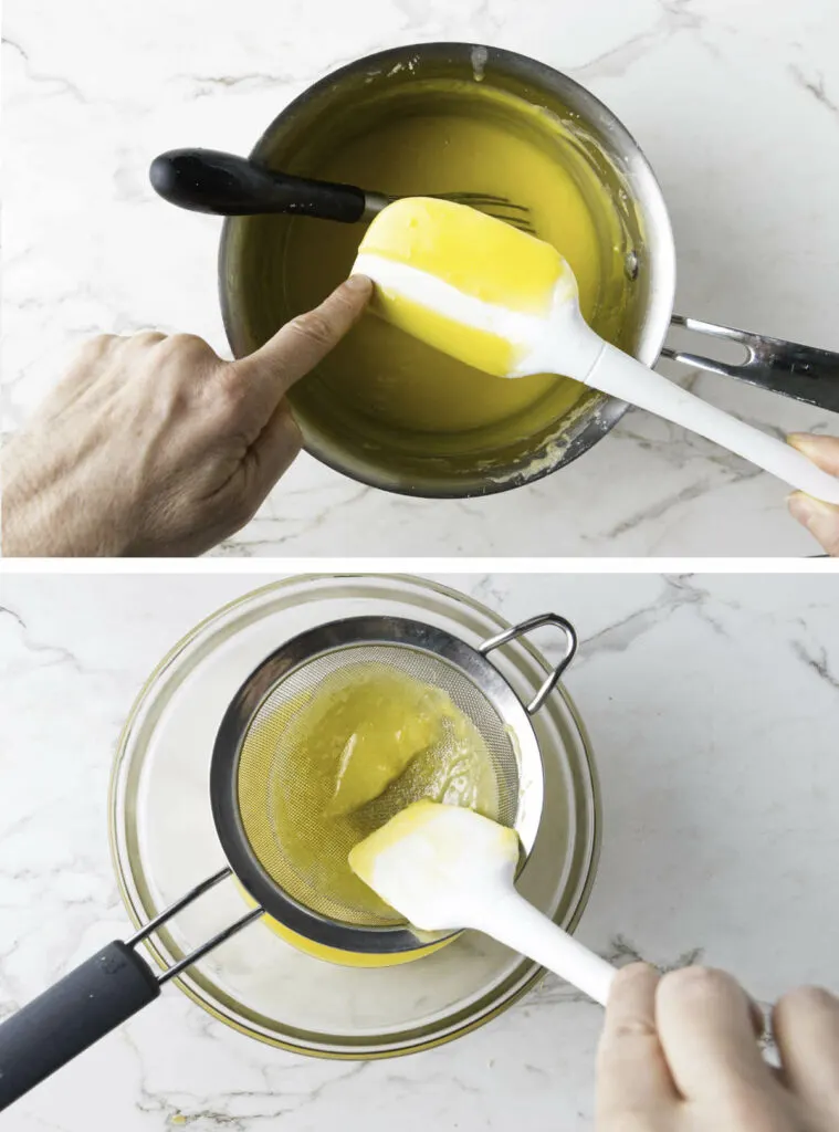 Making lemon curd and straining it through a metal strainer.