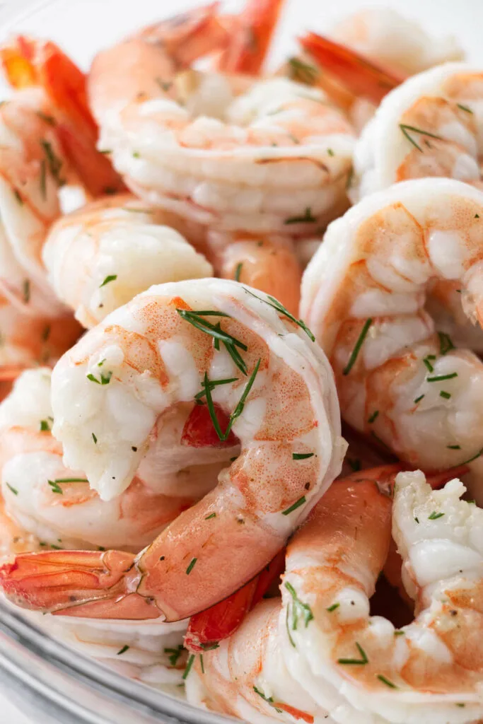 Cooked shrimp tossed with herbs and a marinade.