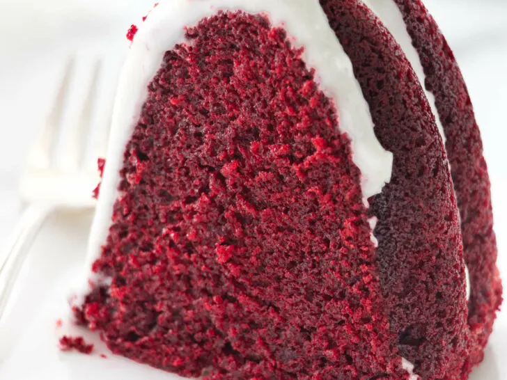 A slice of a red velvet bundt cake on a plate.