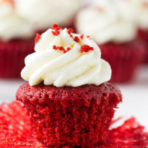 A red velvet mini cupcake with cream cheese frosting.