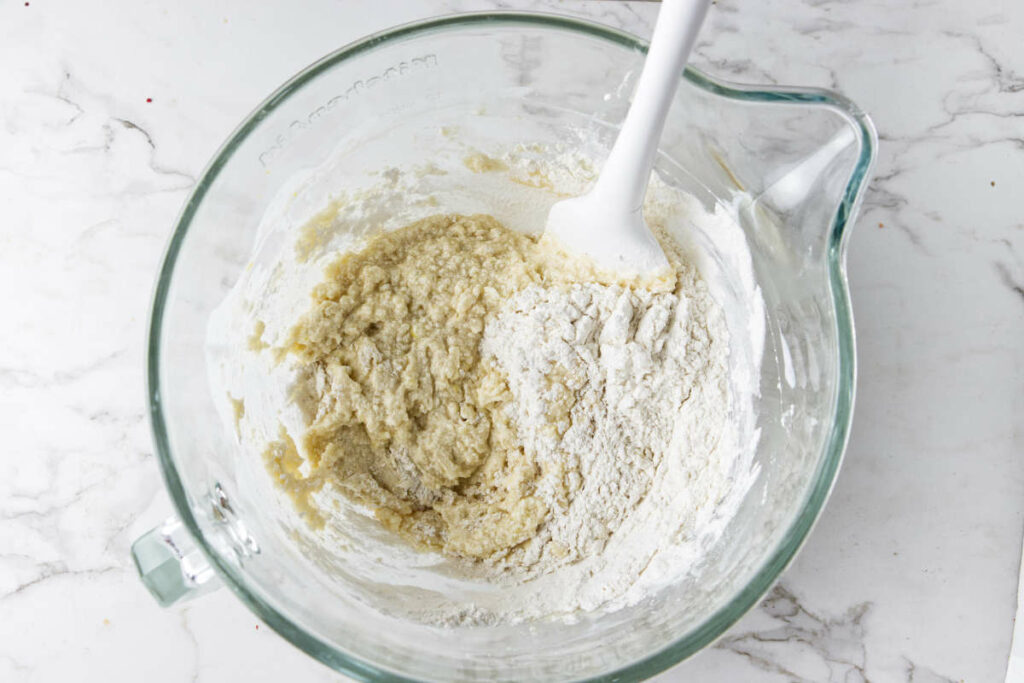 Folding flour into muffin batter.