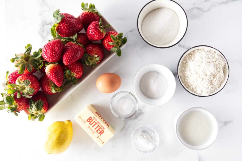 Strawberries, sugar, flour, egg, lemon, salt, baking powder, butter, cornstarch and milk.