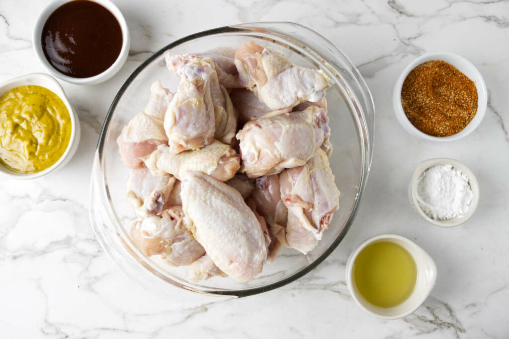 Chicken wings, olive oil, baking powder, bbq spice rub, bbq sauce.