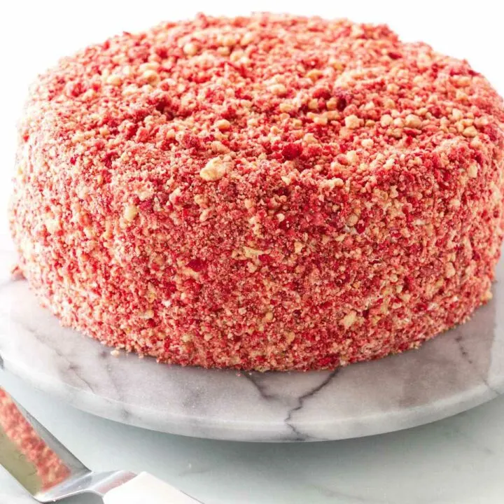 Strawberry crunch crumble covering a cake.